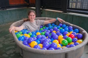 Chimpanzee Caregiver Jill Mullen in a ball pit