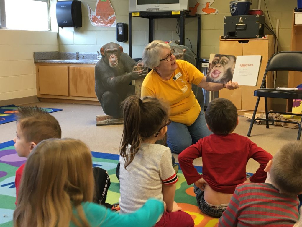 A volunteer visits a local school to teach about the chimps!