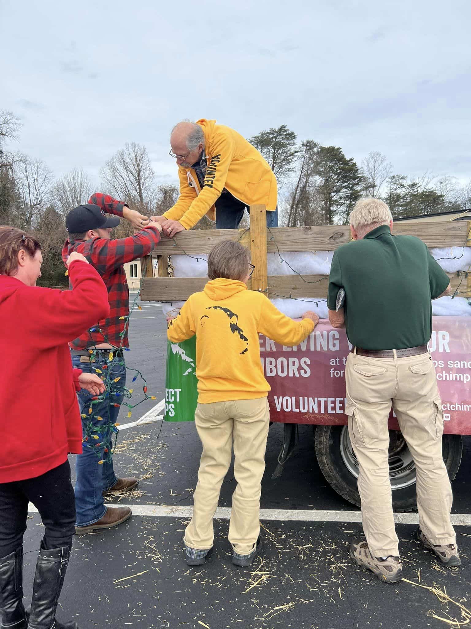 Outreach Volunteers decorate the truck for a parade.